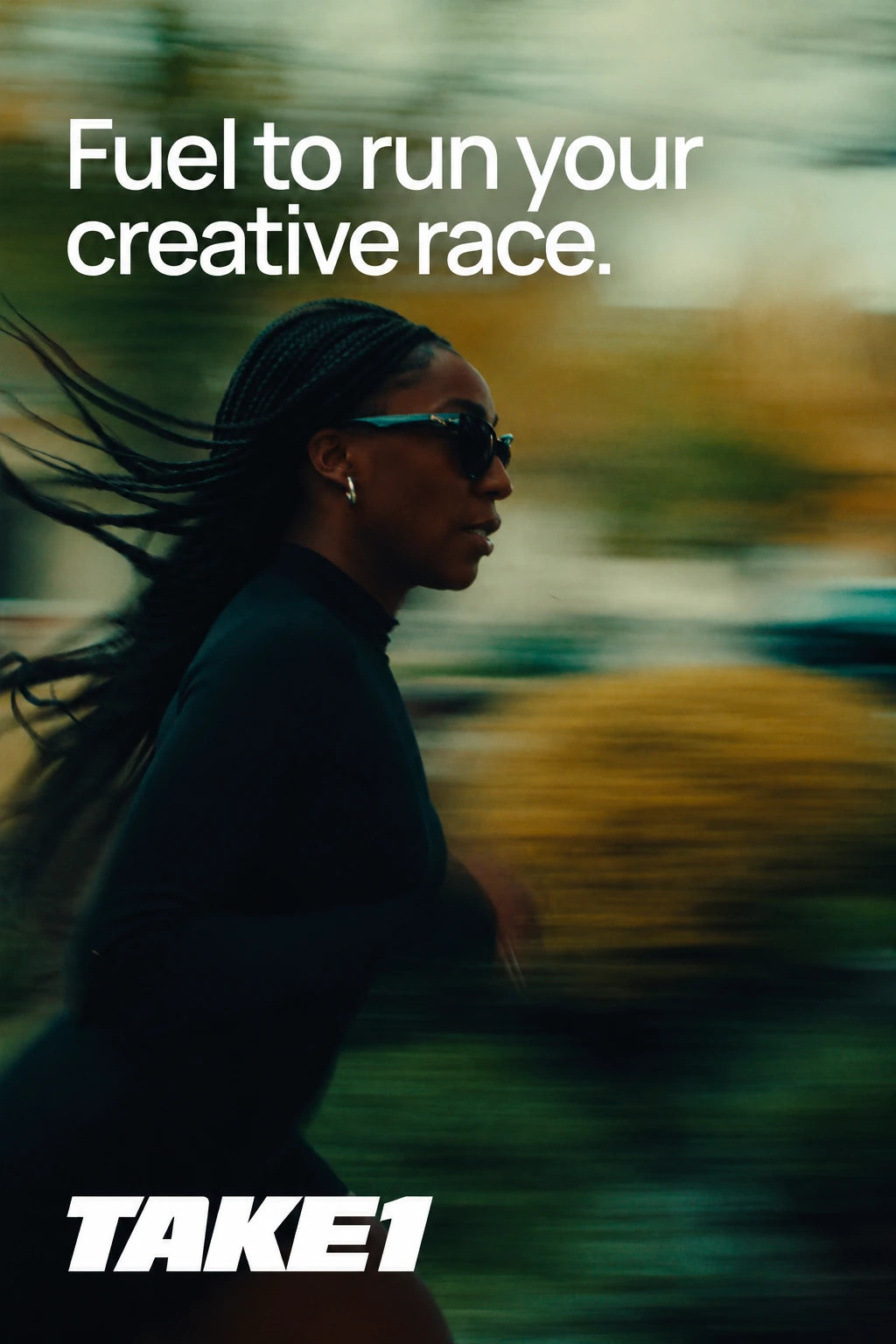 A woman with flowing braids and sunglasses running through a green landscape with motion blur. Fuel to run your creative race. TAKE1.